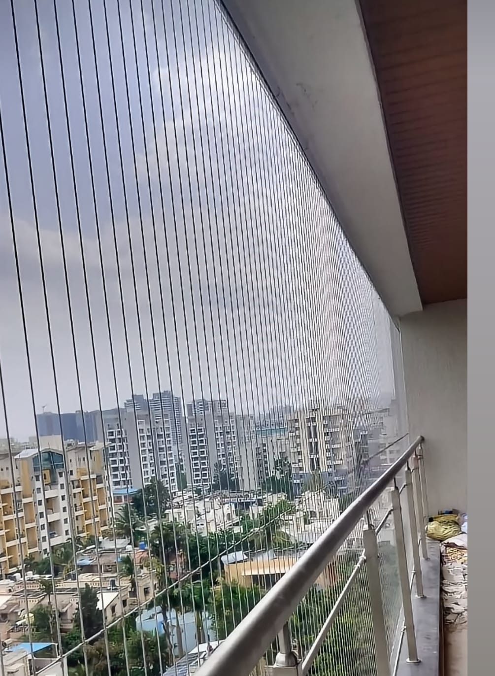 Invisible grill installation on a balcony